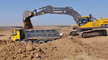 Volvo EC480DL Excavator Loading Volvo Trucks
